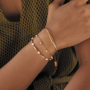 Golden Sofia Pearl Charm Bracelet, on wrist
