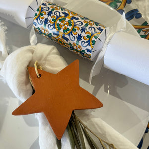 Handcrafted Clay Christmas Star Ornament 2023 on cloth