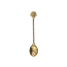 Gold spoon with shell design on a white background